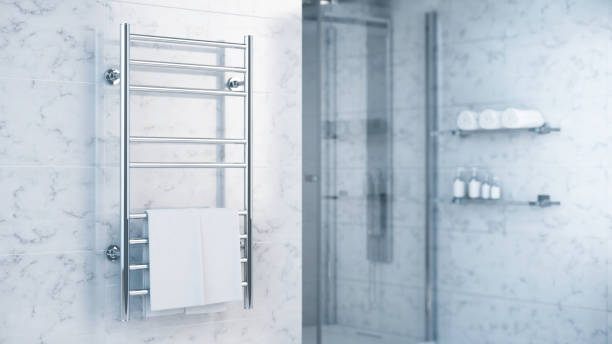Pose d’un sèche serviette électrique dans une salle de bain rénovée dans la Loire